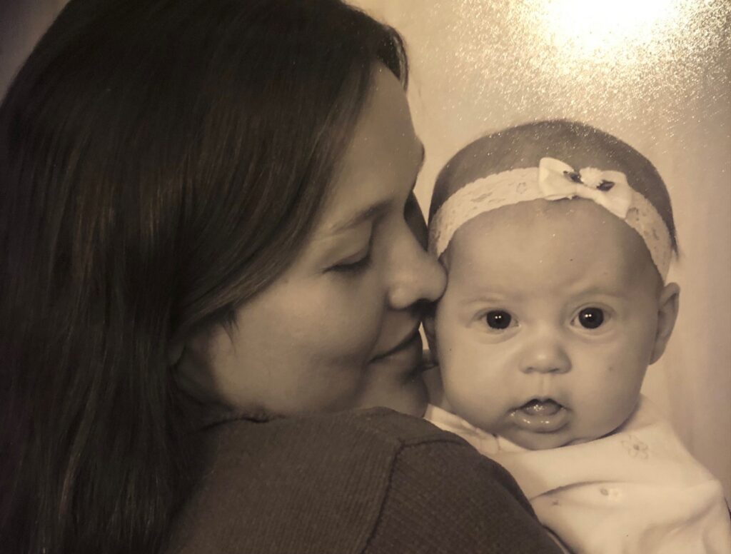 A woman turned to see the baby looking over her shoulder