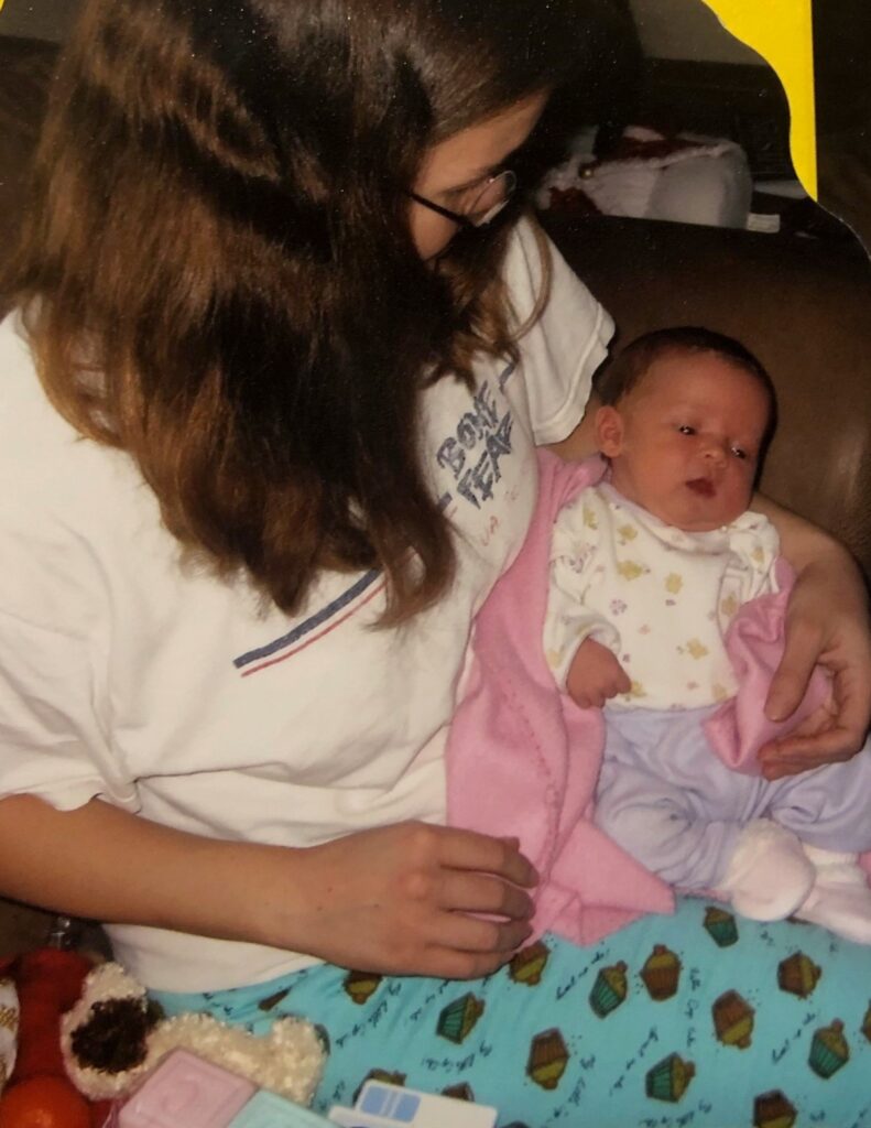 A woman holding a baby on her lap