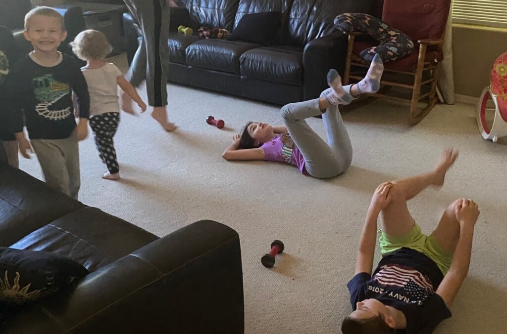 some children on the floor exercising