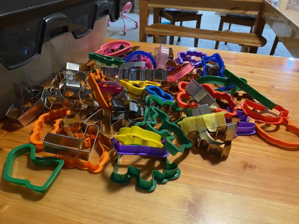 a pile of cookie cutters on a table