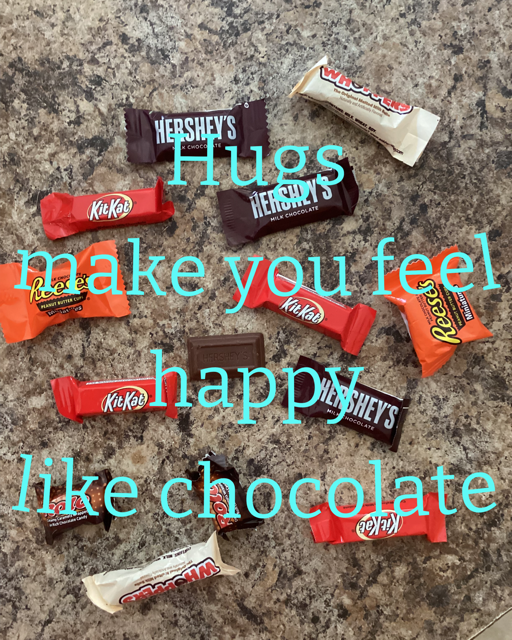 a poster with chocolates and the words "Hugs make you feel happy like chocolate"