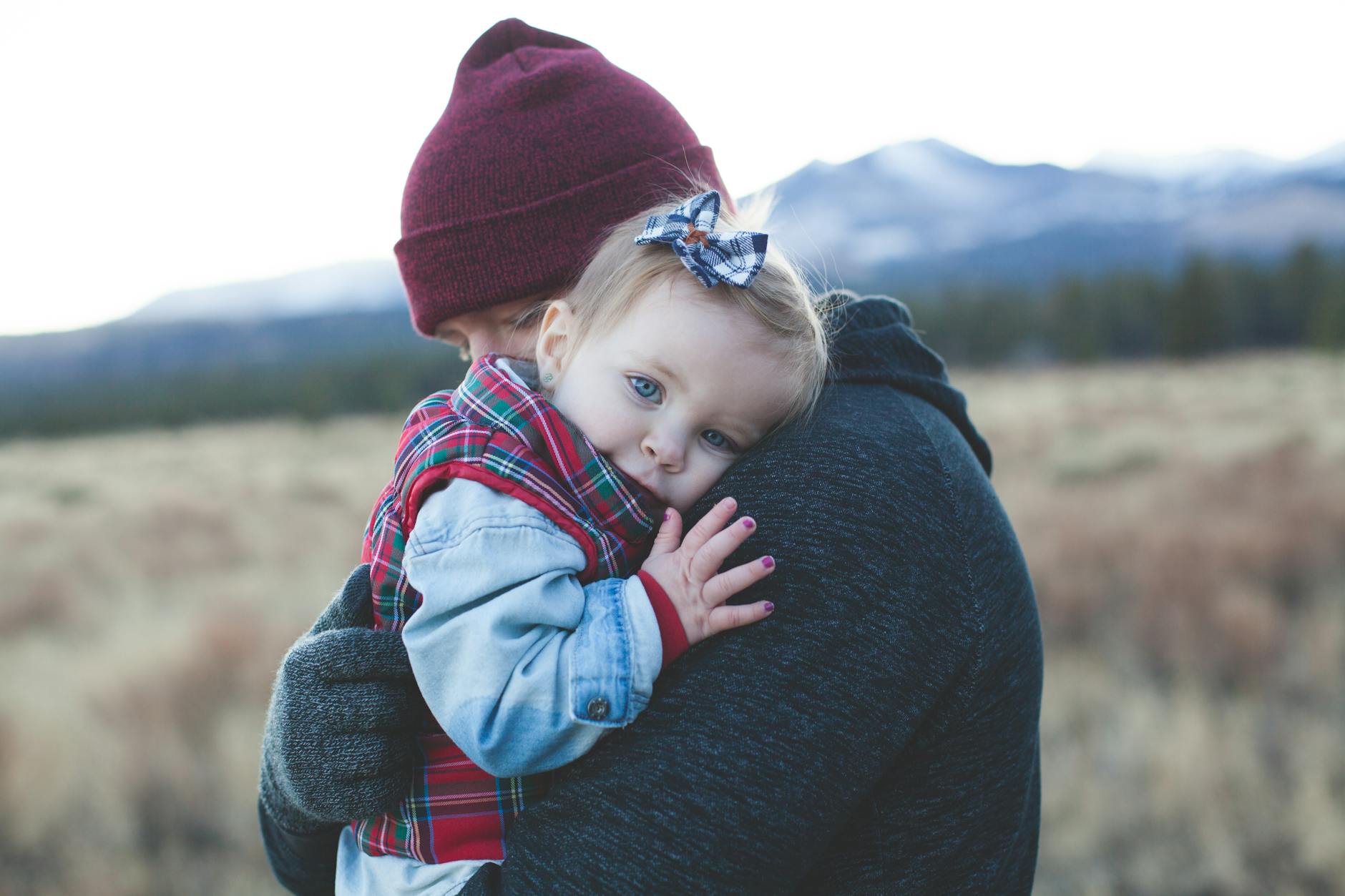 man carrying a baby