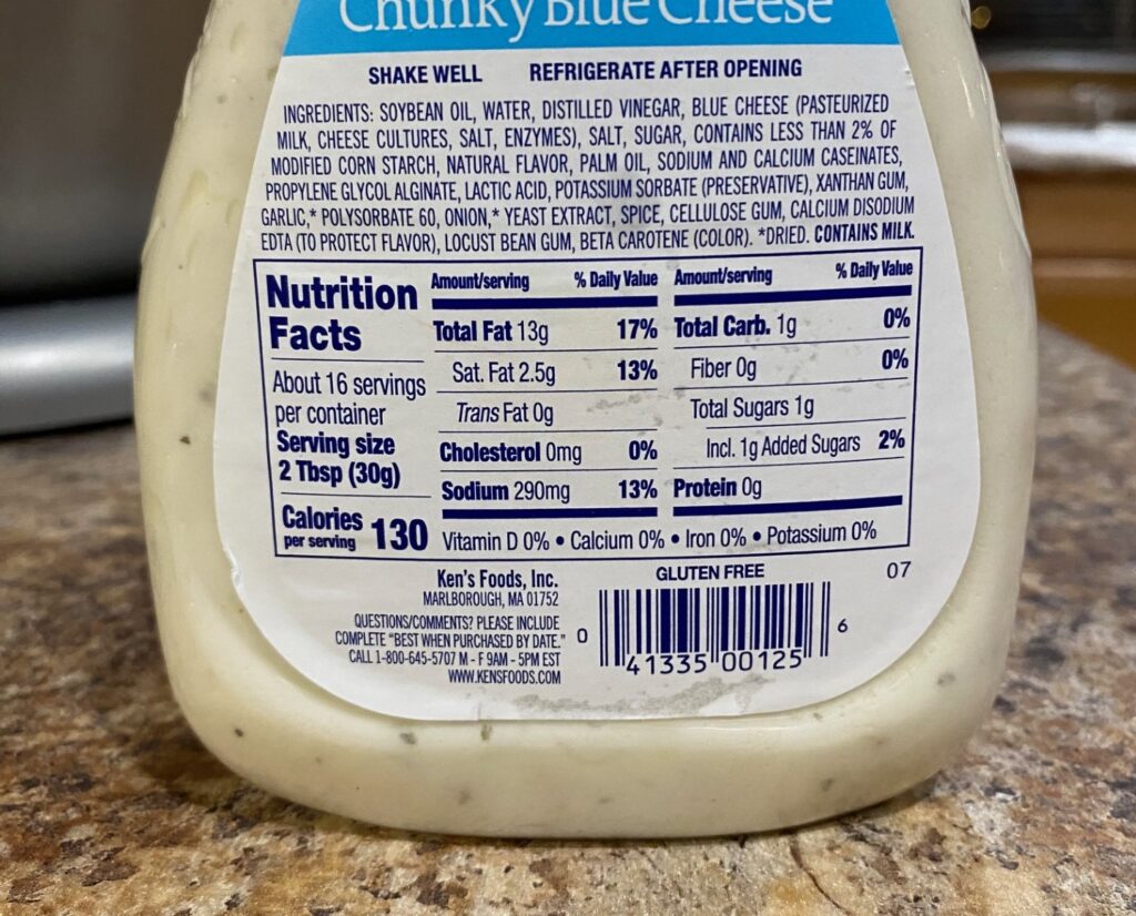 a bottle of salad dressing showing nutrition facts