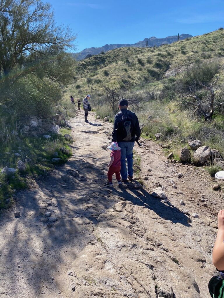 a man and some kids out on a hike