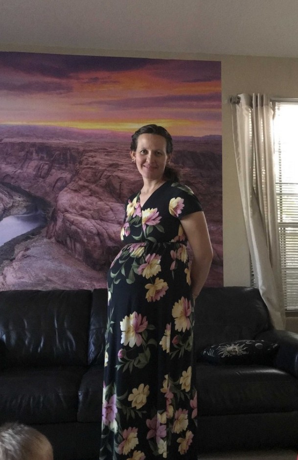 a pregnant woman in a dress