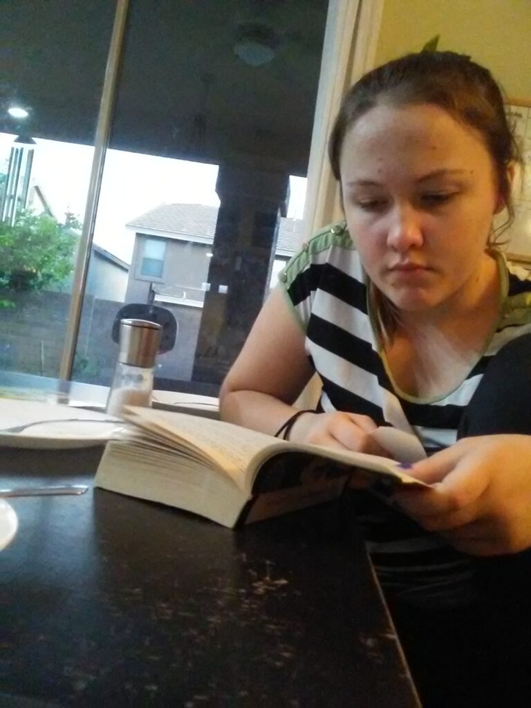 A young teenager reading