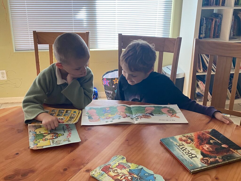 Two boys enjoying a book together