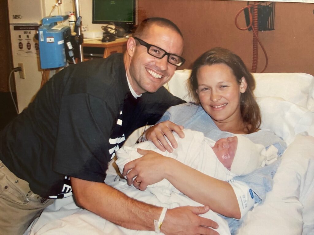 parents in a hospital with a new baby