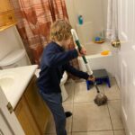 A boy mopping