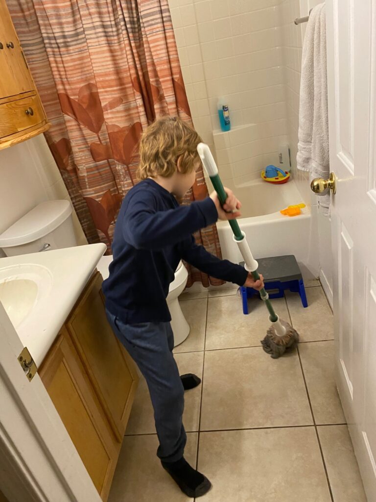 A boy mopping