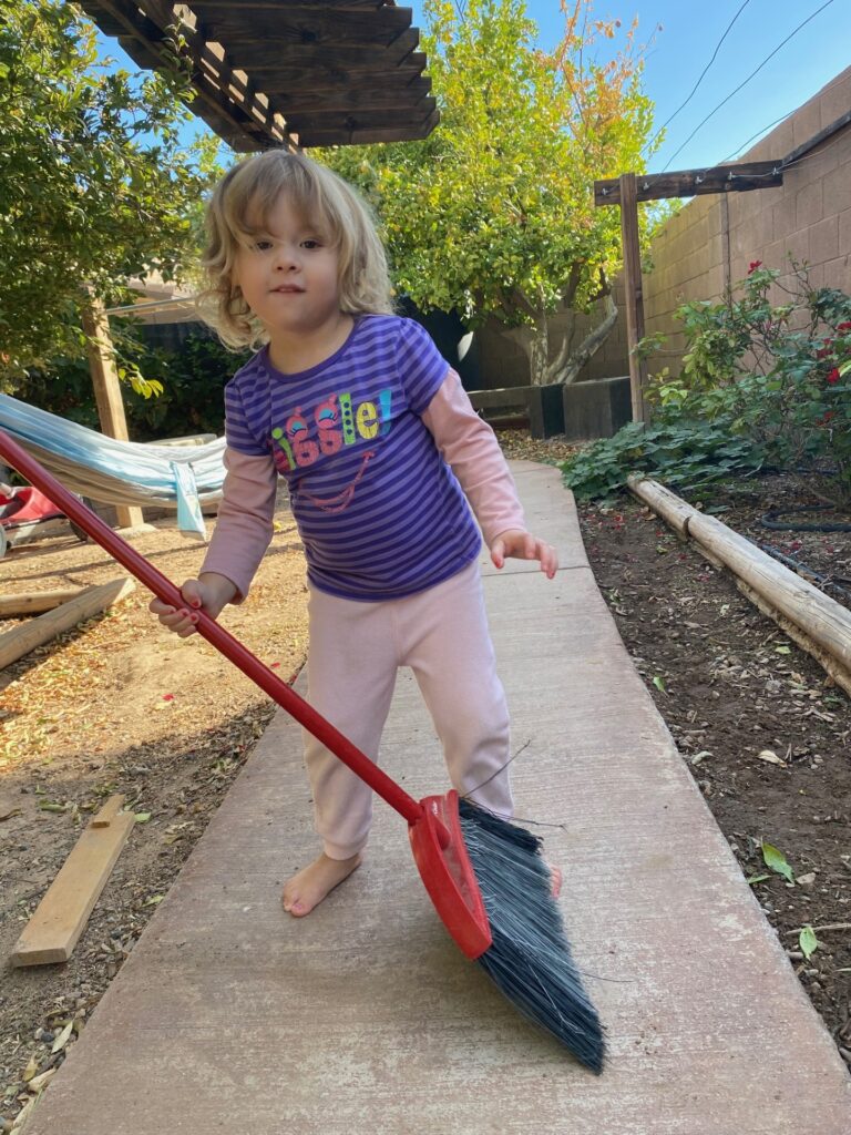 a girl sweeping