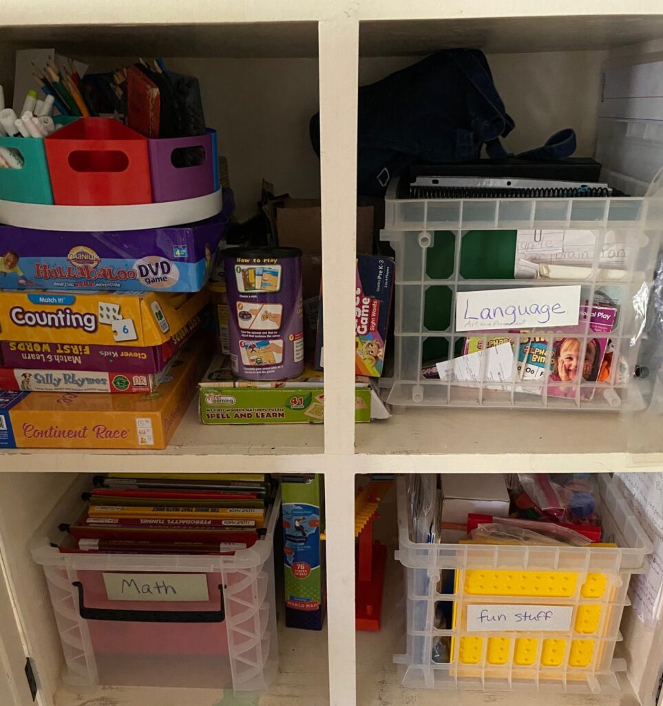 a tidy cupboard full of homeschool things