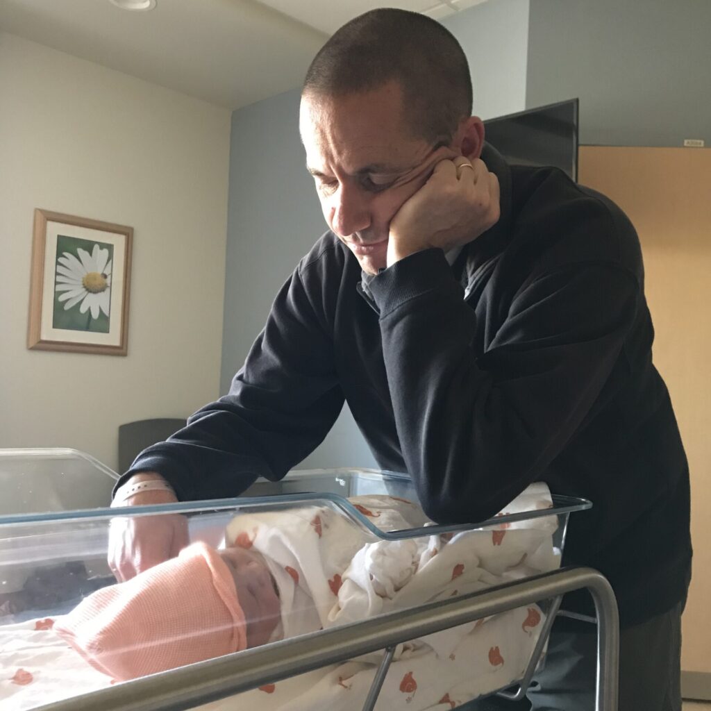 a dad gazing at his new baby