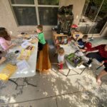 kids at tables doing a project